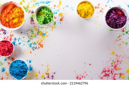 Happy Holi decoration, the indian festival.Top view of colorful holi powder on white background. - Shutterstock ID 2119462796