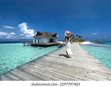 Happy a holiday in Summer blue trend with young woman in hat at happy freedom lifestyle  at Maldives beach