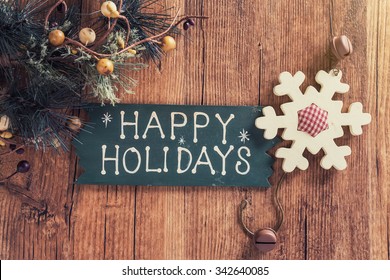happy Holiday written on wooden background 