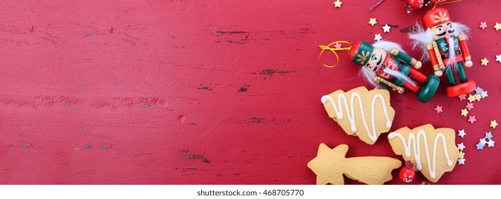 Happy Holidays Christmas background with ornaments and cookies on a red rustic wood background, sized to fit a popular social media cover image placeholder.