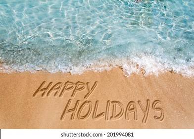 Happy Holidays Sign On The Beach Sand