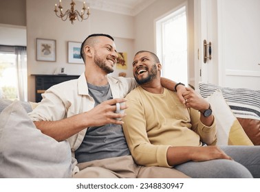 Happy, home and a gay couple on the sofa with coffee, conversation or love in a house. Smile, together and lgbt men on the living room couch for a funny story, communication or speaking with tea - Powered by Shutterstock