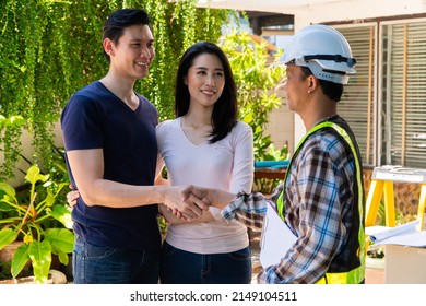 Happy Homeowner Stand In Front Of Contractor And Shake Hand, Handyman Holding Clipboard And After Checking Details Before Renovations Home, House Improvement Interior, Interior Design