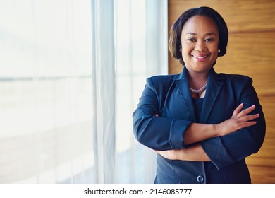 Happy Hour Is 9 To 5. Portrait Of A Confident Businesswoman Standing In Her Office.