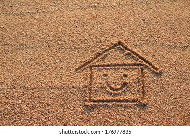 Happy House And Smile Icon Drawn On Beach Sand