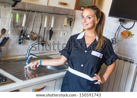 Happy Housemaid with Clean Kitchen