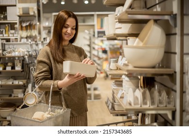 Happy Housewife Choosing Eco Friendly Ceramic Case With Wooden Lid For Food Storage Comfortable Placing In Kitchen Cupboard. Smiling Female With Box Container Enjoying Shopping At Household Store