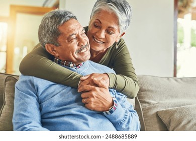 Happy, hug and elderly couple on sofa for love, wellness and pleased for successful retirement. Senior woman, man and smile at home for life insurance, financial security and good news in marriage - Powered by Shutterstock