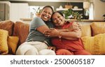 Happy, hug and portrait of black woman with senior mother on sofa in home for womens day celebration together. Smile, bonding and African female person embracing mom for connection in living room.