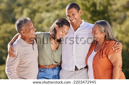Happy, hug and smile, an adult family in a park standing together. Mother, father grown up kids laughing. Happiness, love and nature, man and woman with senior couple in nature at an outdoor event.