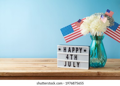 Happy Independence Day, 4th Of July Celebration Concept With Home Decor And USA Flag On Wooden Table