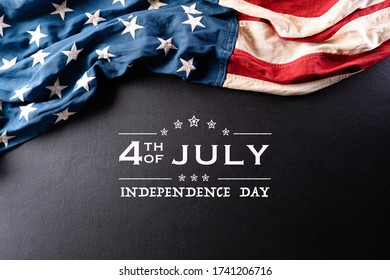 Happy Independence Day. American flags against a black  background. July 4.