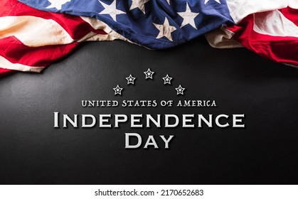 Happy Independence day concept made from American flag and the text on dark wooden background. - Shutterstock ID 2170652683