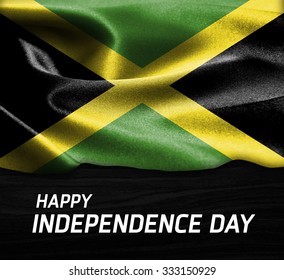 Happy Independence Day Jamaica Flag On Wood Texture Background