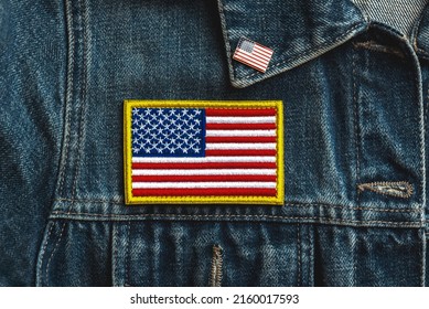 Happy Independence Day July 4th. American Flag Textile Patch On A Denim Jacket And American Pin. Celebrating Independence Day Concept