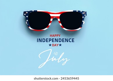 Happy Independence day July 4th. Closeup of USA flag sunglasses with text Happy Independence day July 4th over blue background