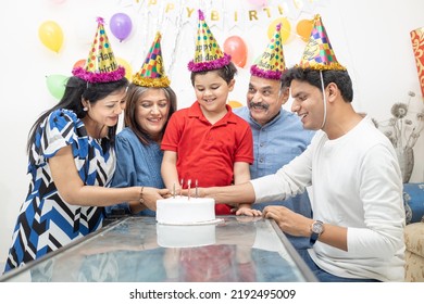 Happy Indian Asian Multi Generational Family Celebrate Children's Birthday Party.