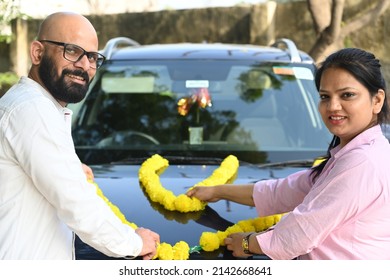 Happy Indian Couple Buying A New Car.