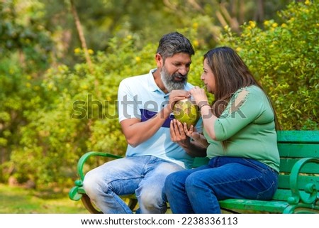 Similar – Man holding hot dog in barbecue with friends