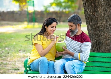 Similar – Man holding hot dog in barbecue with friends