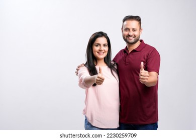 Happy indian couple on white background. - Shutterstock ID 2230259709