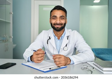 Happy Indian Doctor Talking To Webcam Consulting Remote Patient Online On Distance Video Call. Virtual Telemedicine Chat, Videocall Healthcare Consultation Visit. Telehealth Concept. Web Cam View