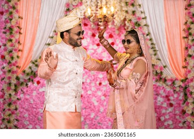 Happy Indian Excited Dancing Father with Bride daughter during wedding on stage - concept of joyful Marriage, responsibility and Memorable Moment
