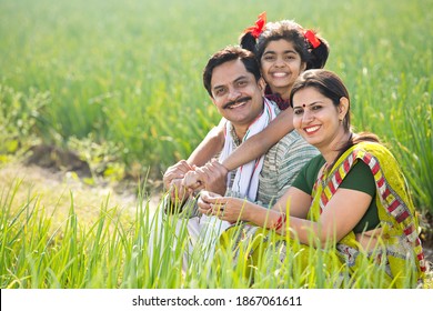 Happy Indian Family In Agricultural Field