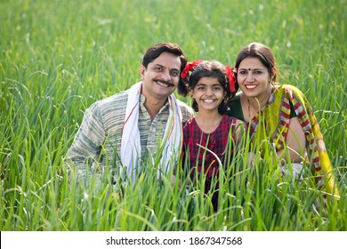 Happy Indian Family In Agricultural Field