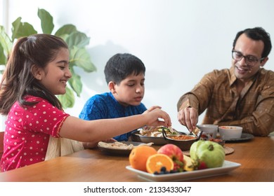 Happy Indian Family Enjoy With Indian Food, Having Family Dinner