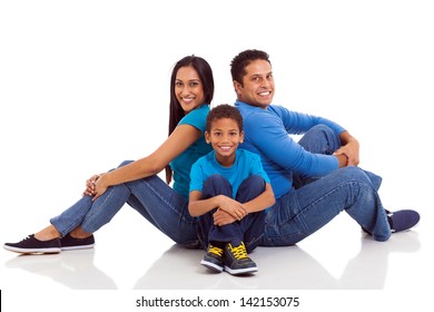 happy indian family sitting on the floor isolated on white - Powered by Shutterstock