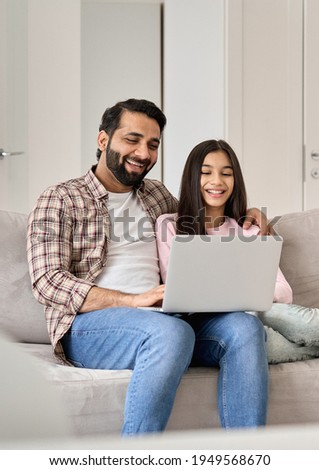 Similar – Happy child with laptop computer on brick background