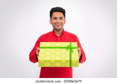 Happy Indian Man Giving Gift Box