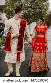 Happy Indian Newlyweds Walking In The Park