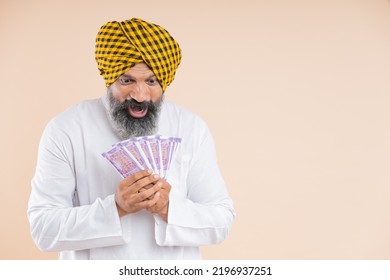 Happy Indian Sikh Farmer With Cash 