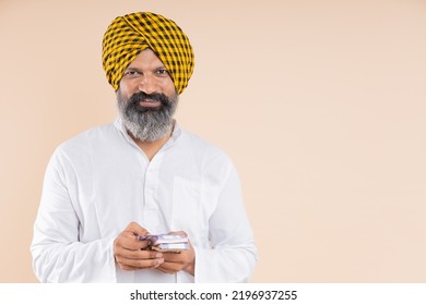 Happy Indian Sikh Farmer With Cash 