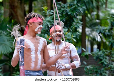 Happy Indigenous Australians Men Hunting In A Rain Forest Of Cape York Peninsula In The Tropical Far North Of Queensland, Australia. Real People. Copy Space 