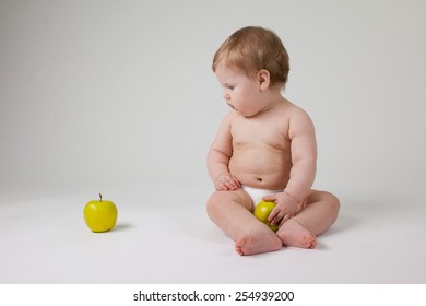 happy infant with fruits