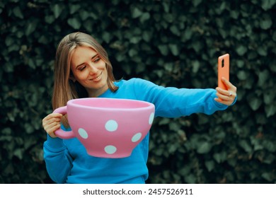 
Happy Influencer Holding a Cup of Coffee taking Selfies
Cheerful girl taking pictures with a beverage
