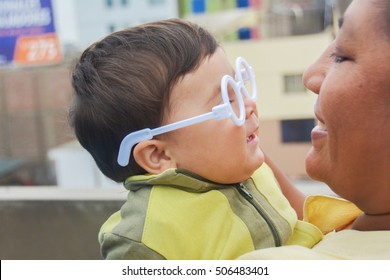 Happy International Family - Latin Mother And Son Wearing Glasses