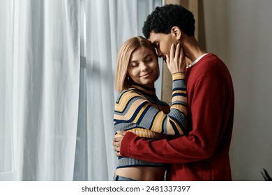 A happy interracial couple enjoys a tender moment together in their modern apartment, showcasing the beauty of diverse relationships. - Powered by Shutterstock