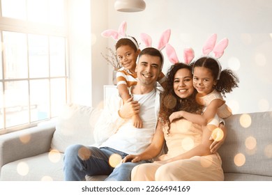 Happy interracial family in Easter bunny ears at home - Powered by Shutterstock