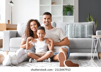 Happy interracial family at home - Shutterstock ID 2113447913