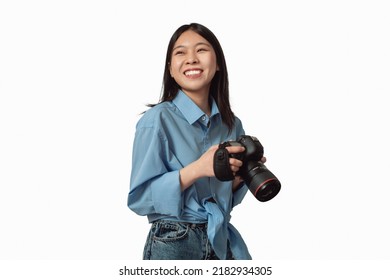 Happy Japanese Photographer Lady Posing Holding Photo Camera Over White Studio Background. Professional Creative Photography Career And Education Concept. Isolated - Powered by Shutterstock