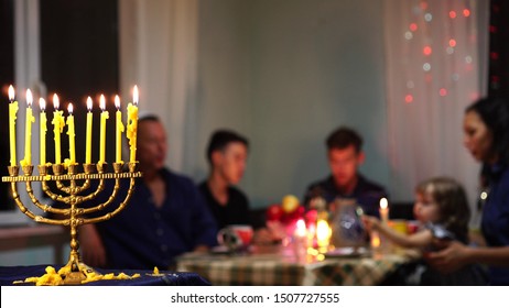 Happy Jewish Family Celebrates Hanukkah. Festival Of Lights. Israel People. The Hanukkah Menorah