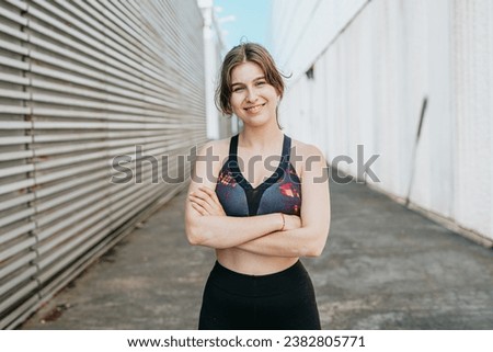 Image, Stock Photo Happy jovial healthy young woman posing between building in urban environment with sporty atmosphere