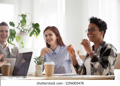 Happy Joyful Diverse Business People Laughing At Funny Joke Talking At Work Break, Cheerful Corporate Team Office Workers Multi-ethnic Young Coworkers Having Fun Engaged In Teambuilding Activity