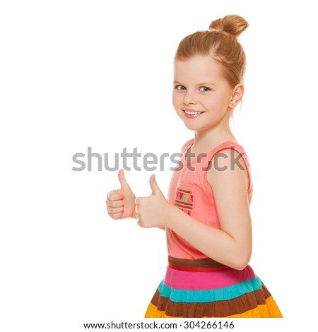 Happy joyful little girl smiling showing thumbs up, isolated on white background