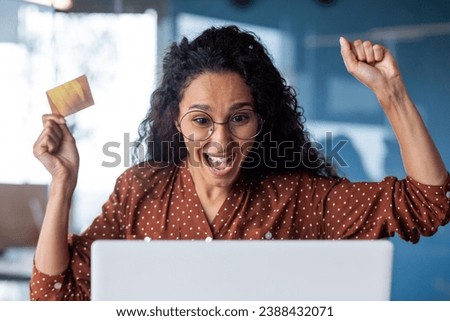 Happy joyful woman bought bargain online product with discount, business woman celebrating successful online shopping at workplace inside office, holding bank credit card, using laptop.