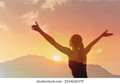 Happy joyful woman standing with her back on sunset in nature . - Powered by Shutterstock